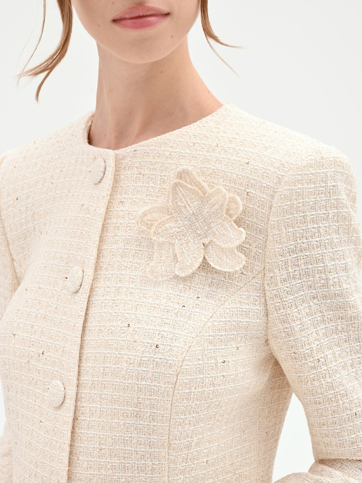 Giacca bouclé beige chiaro con fiore applicato
