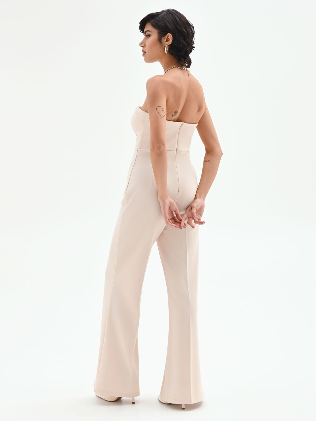 Tuta palazzo beige chiaro con bottoni e bustier