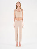 Top crop beige chiaro con doppie spalline