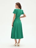 Abito midi verde con gonna plissé