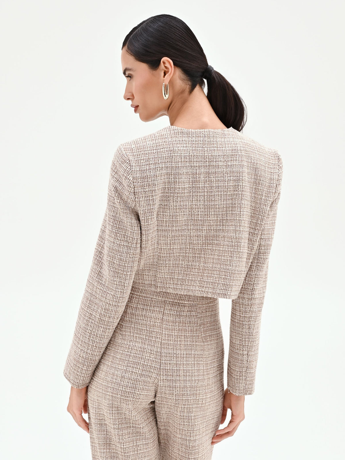 Giacca beige chiaro in tweed con tasche applicate