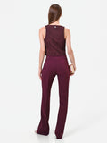Pantalone svasato bordeaux in tessuto tecnico con fascione in vita