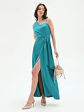 Abito lungo atelier verde smeraldo con drappeggio laterale
