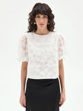Blusa bianca in organza con maxi fiori applicati