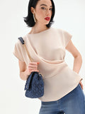 Blusa beige chiaro con drappeggio asimmetrico