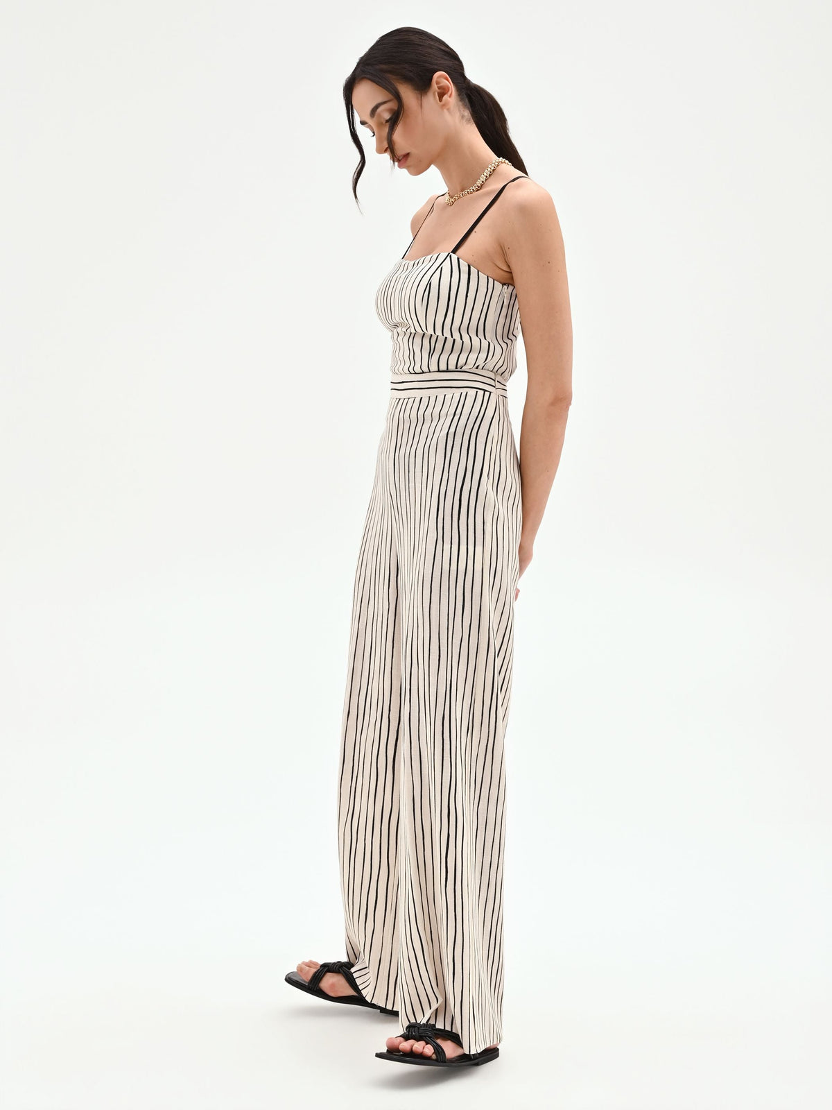 Pantalone in lino panna a palazzo con fantasia a righe