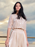 Crop top beige chiaro con paillettes