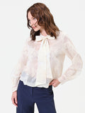 Blusa in pizzo panna con fiocco al collo