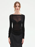 Blusa nera con drappeggio laterale