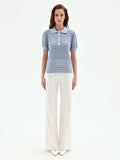 Polo in maglia azzurra a righe