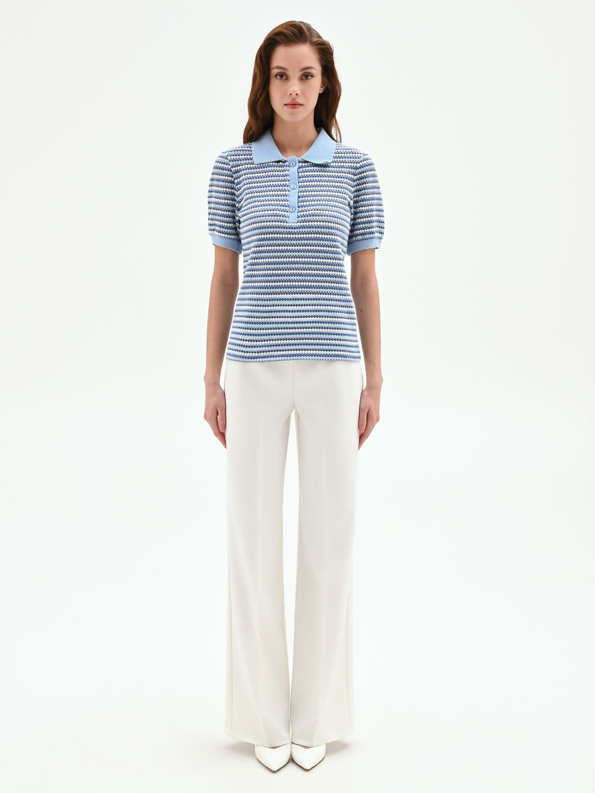 Polo in maglia azzurra a righe