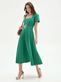 Abito midi verde con gonna plissé