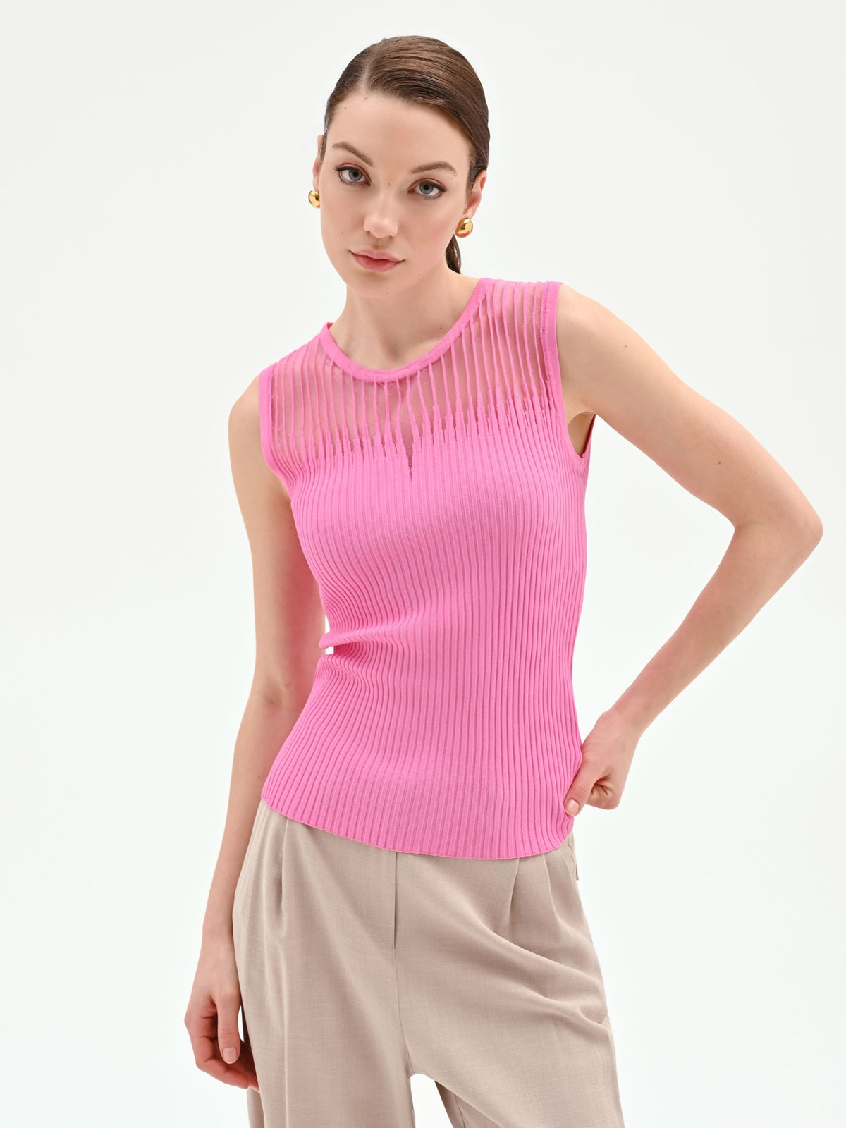 Top rosa in maglia a costine con inserto a righe