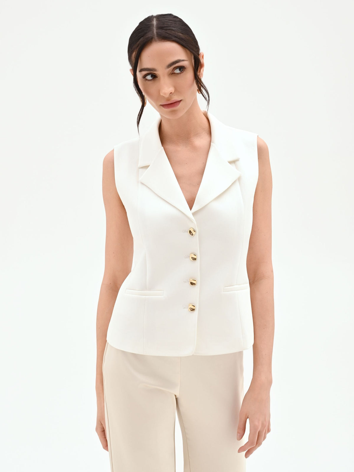 Gilet panna con bottoni design oro