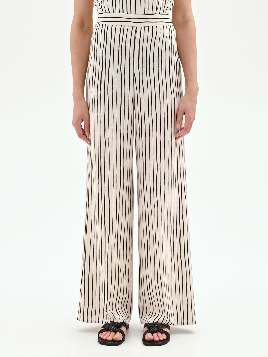 Pantalone in lino panna a palazzo con fantasia a righe