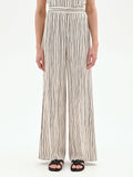 Pantalone in lino panna a palazzo con fantasia a righe