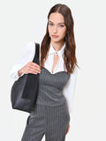 Blusa grigia con bustier gessato e paillettes
