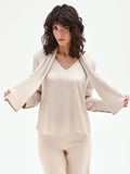 Blusa beige chiaro con foulard plissettato