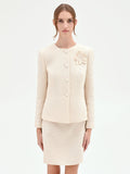 Giacca bouclé beige chiaro con fiore applicato