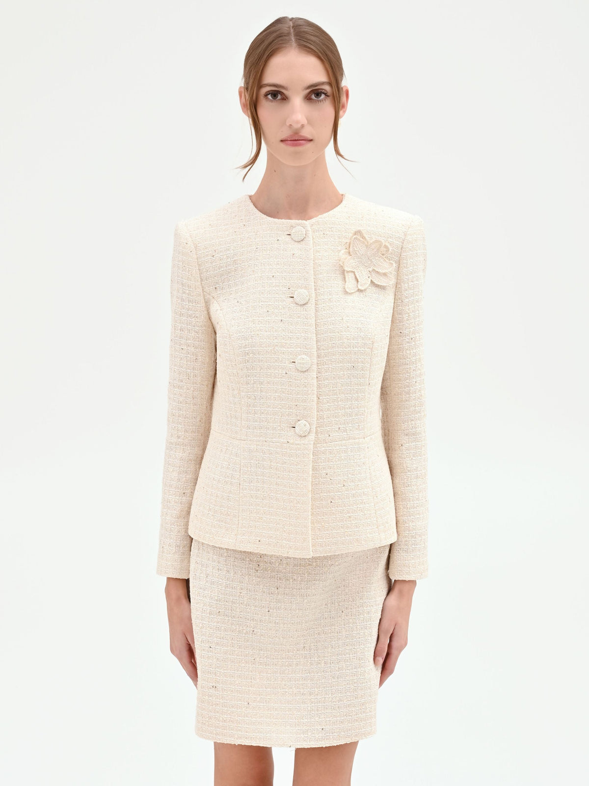 Giacca bouclé beige chiaro con fiore applicato