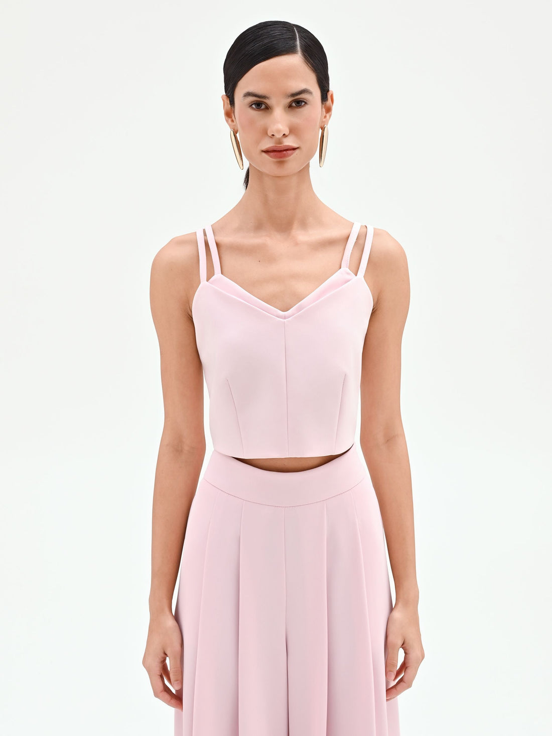 Top corto rosa pastello con doppie spalline