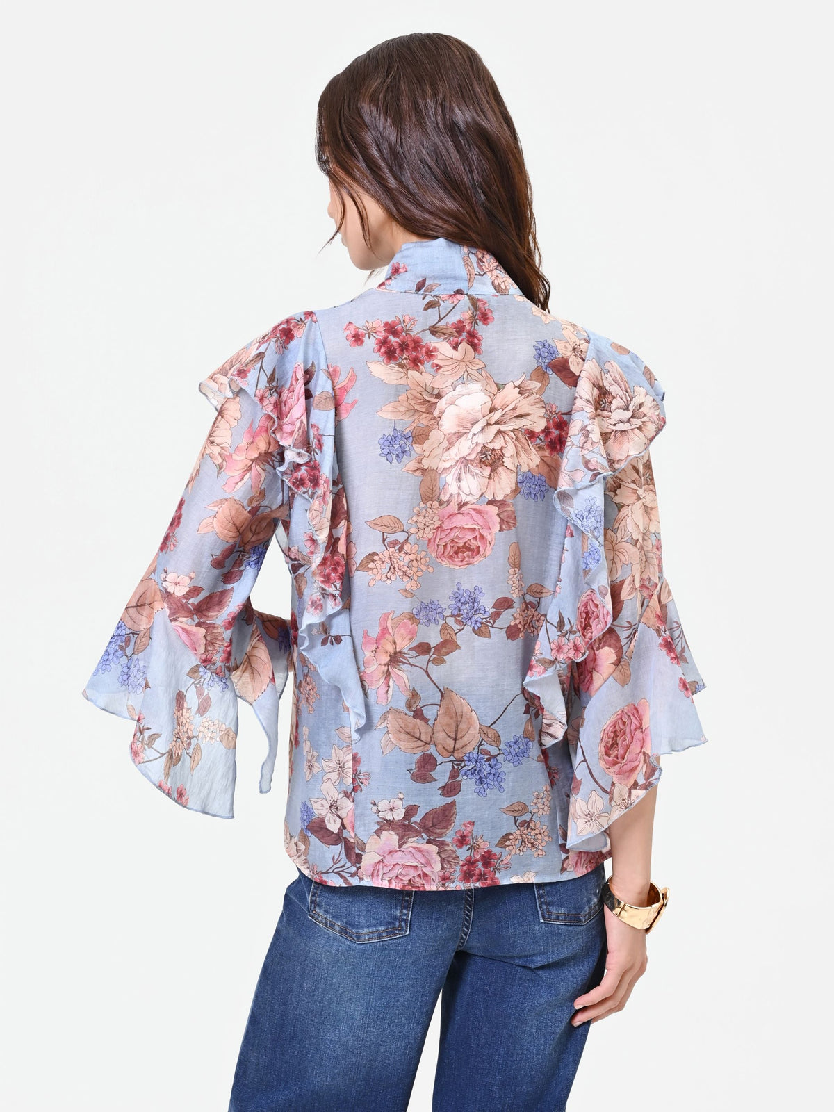 Blusa azzurra con fantasia floreale e fiocco