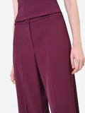 Pantalone a palazzo bordeaux dalla linea fluida