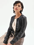 Giacca similpelle nera con zip e arricciature