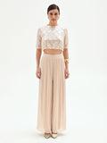 Pantalone a palazzo beige chiaro in raso cangiante