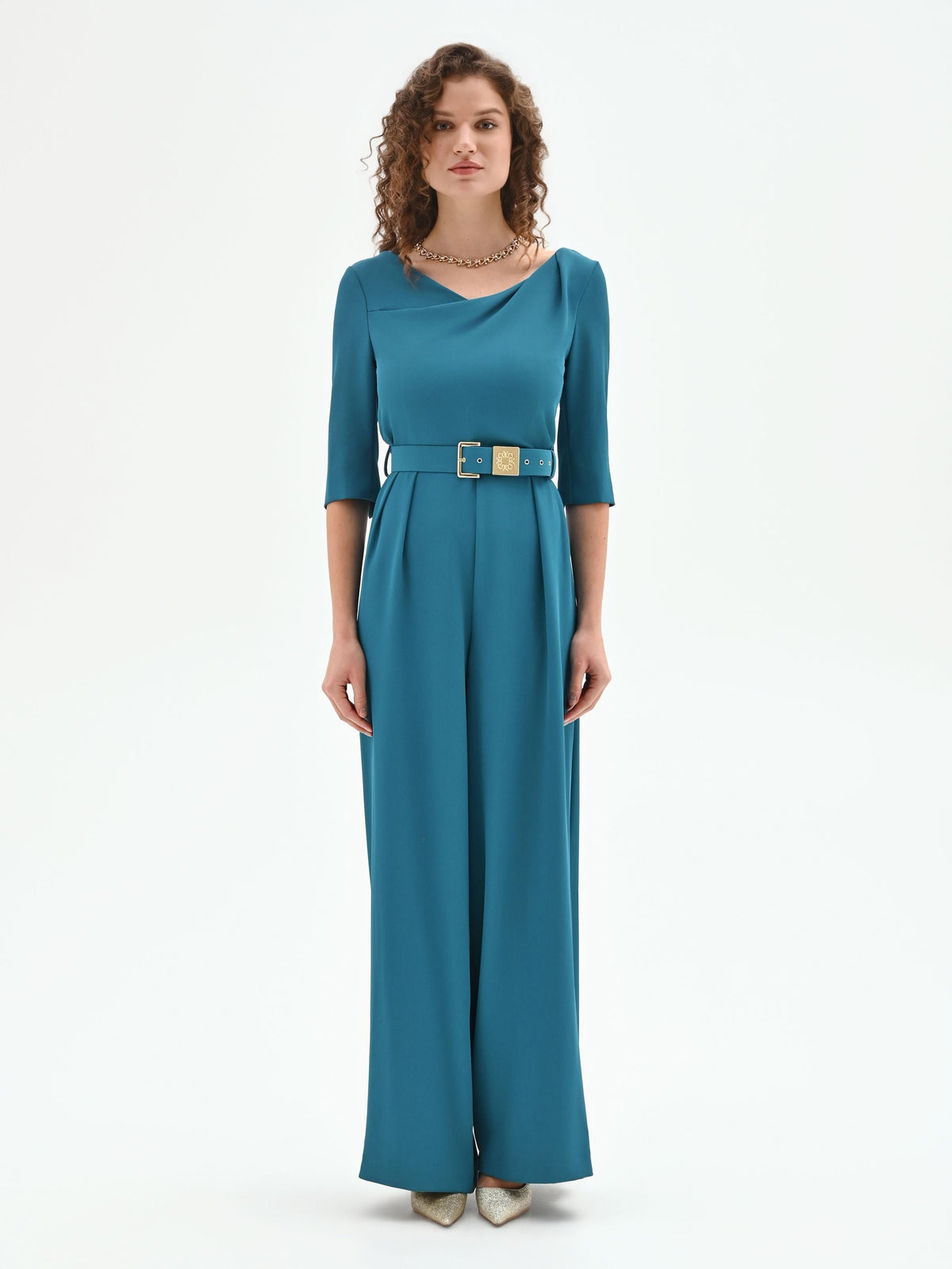 Tuta verde ottanio con scollo drappeggiato