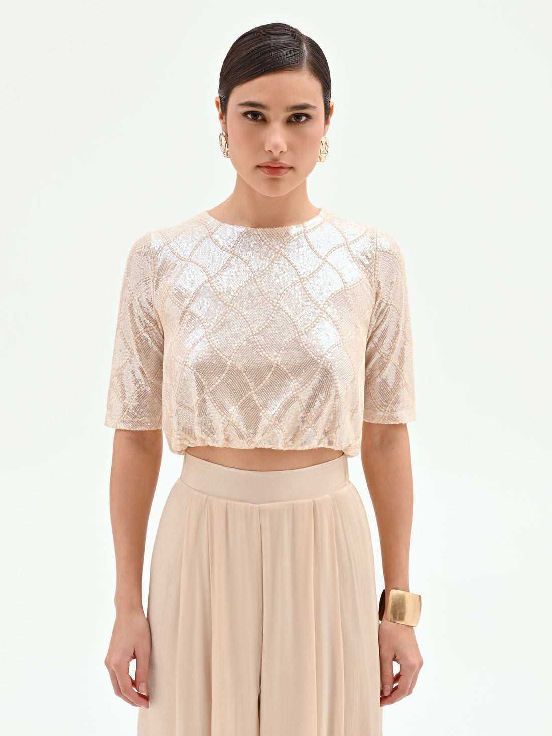 Crop top beige chiaro con paillettes