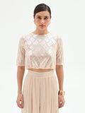 Crop top beige chiaro con paillettes