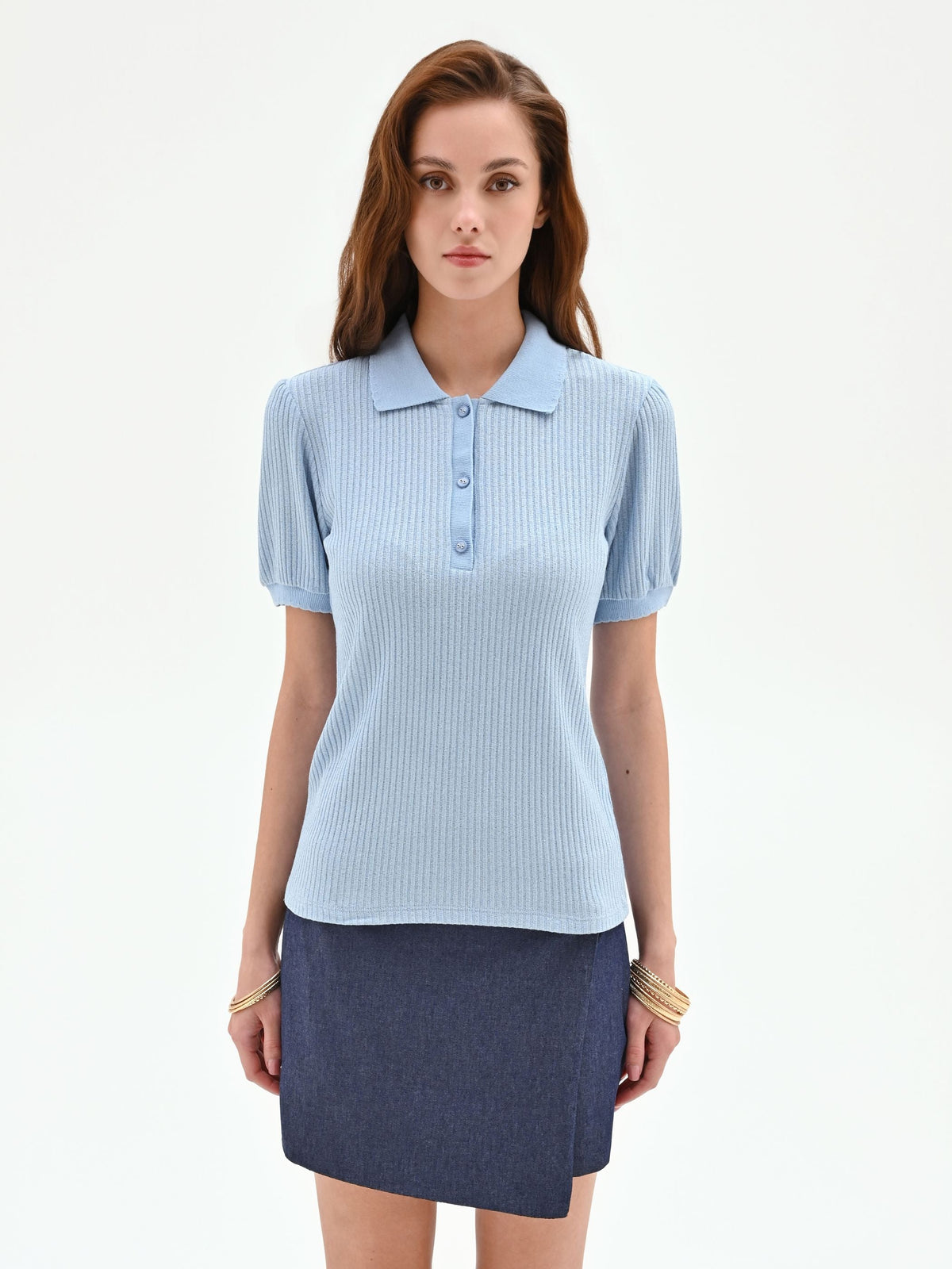 Polo azzurra in maglia a costine