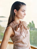 Top marrone bronzo con fiocco e punti luce