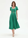 Abito midi verde con gonna plissé