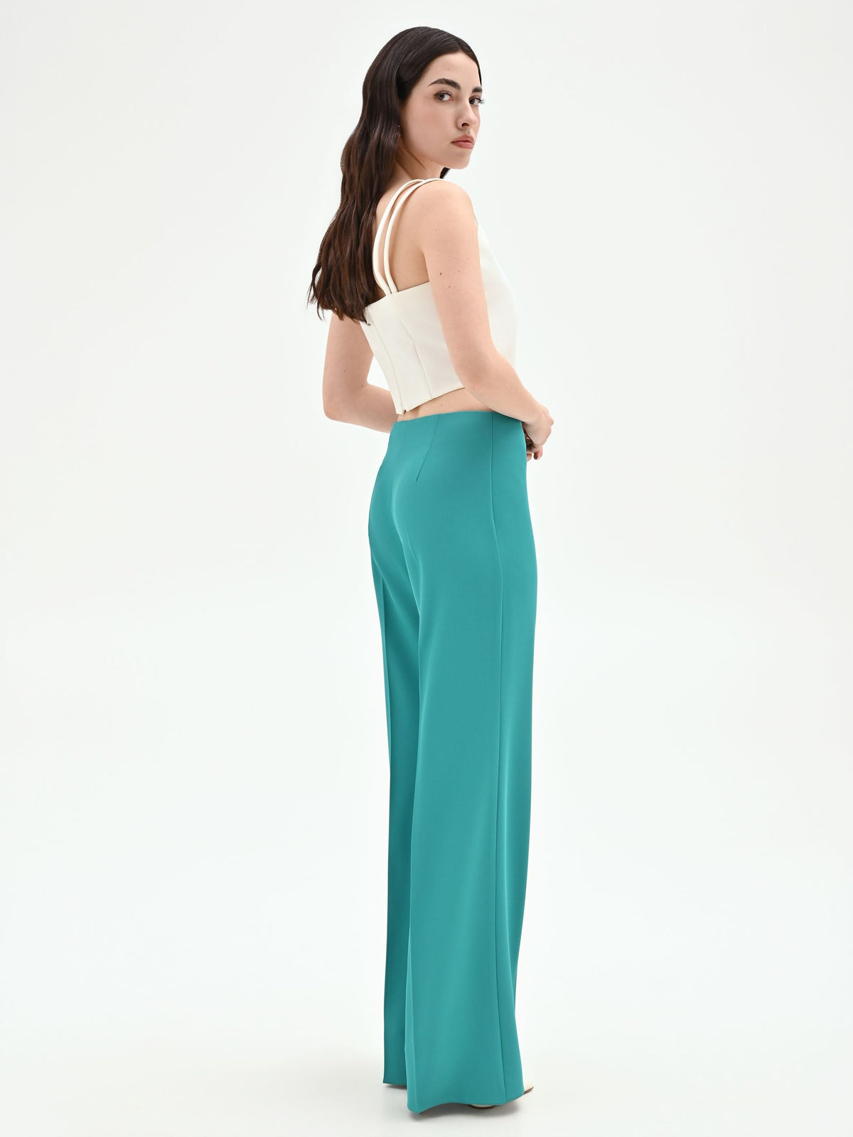 Pantalone palazzo turchese azzurro dalla linea fluida