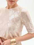 Crop top beige chiaro con paillettes