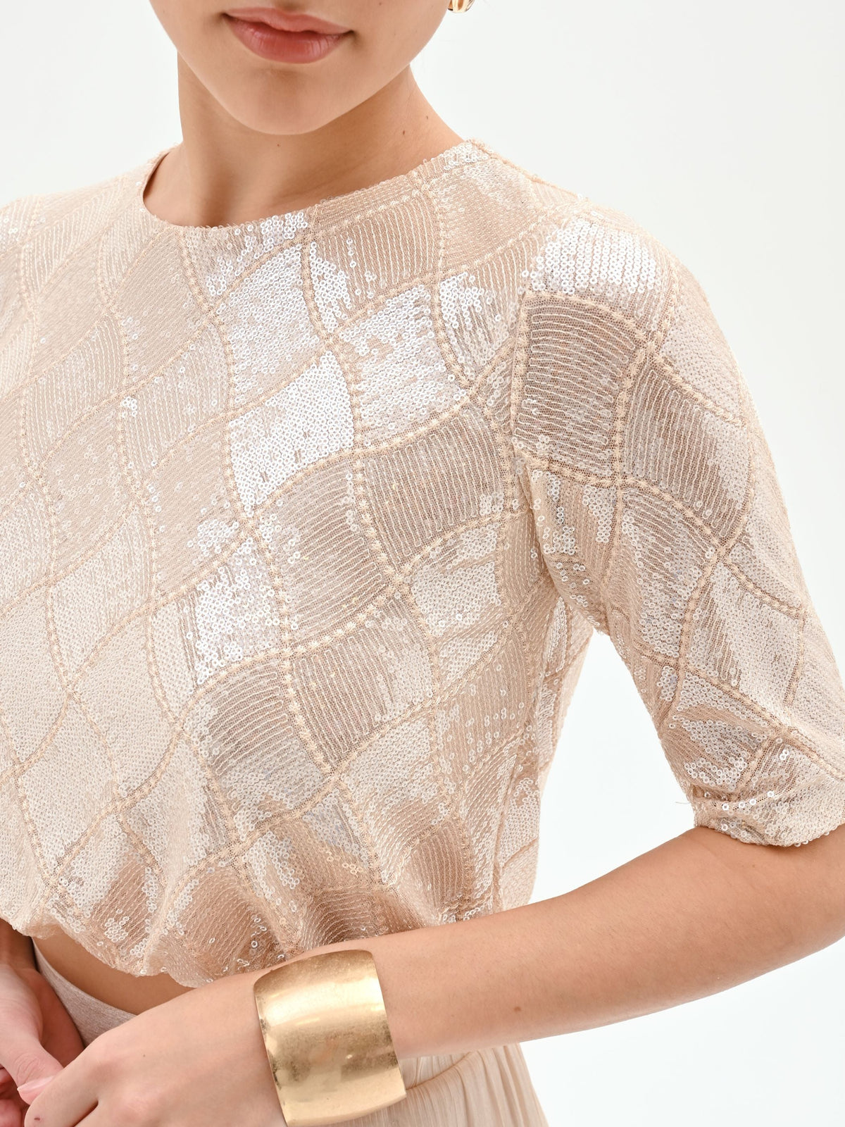 Crop top beige chiaro con paillettes