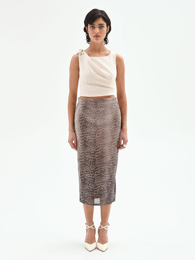 Top asimmetrico panna con accessorio oro