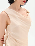 Tuta elegante beige chiaro con corpetto drappeggiato