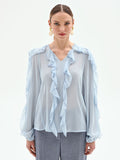 Blusa azzurro cielo con rouches