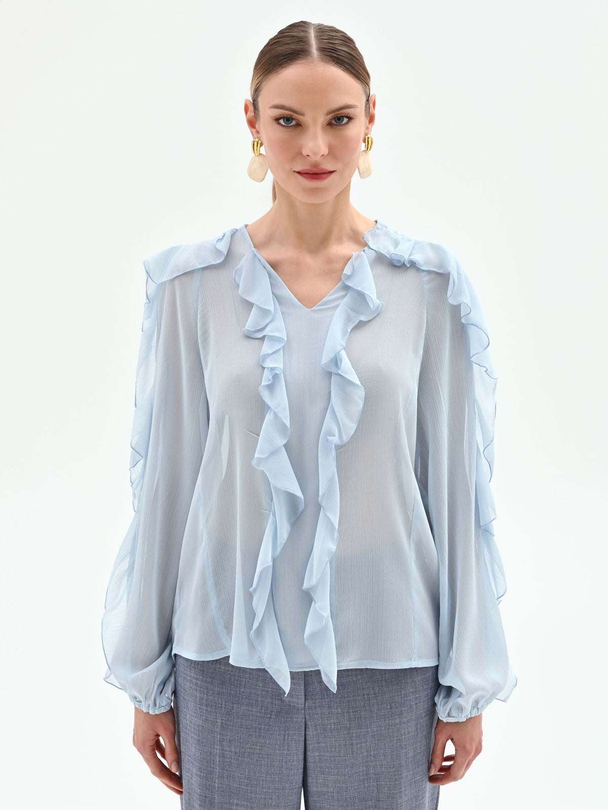 Blusa azzurro cielo con rouches