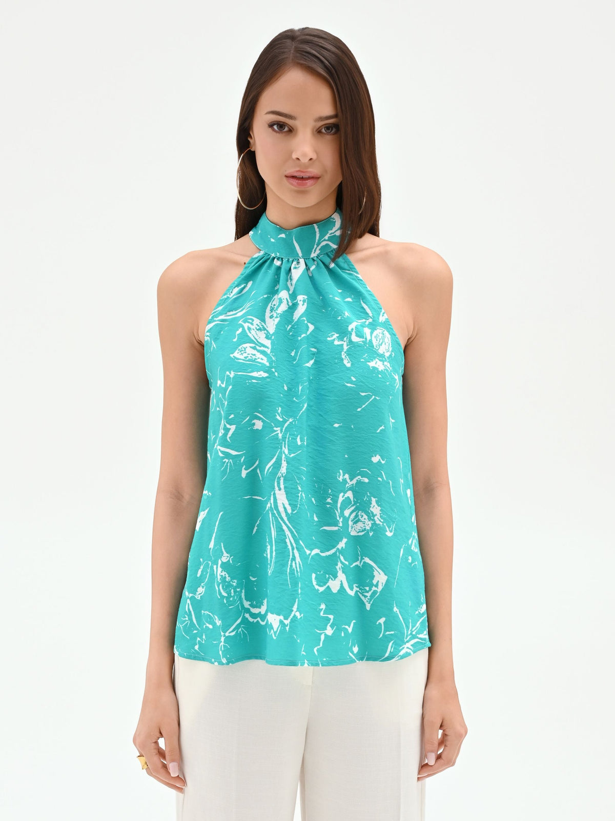 Top turchese con collo arricciato e fantasia