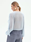 Blusa azzurro cielo con rouches