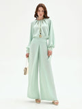 Pantalone palazzo verde menta con spacco frontale