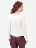 Blusa bianca con drappeggio asimmetrico