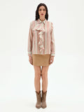 Camicia rosa a righe con rouche