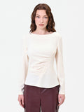 Blusa bianca con drappeggio asimmetrico