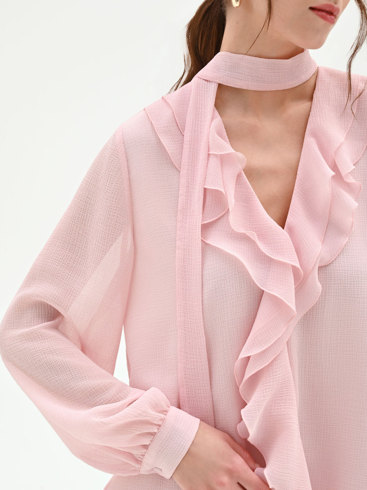 Blusa rosa chiaro con rouche e nastro lavalliere