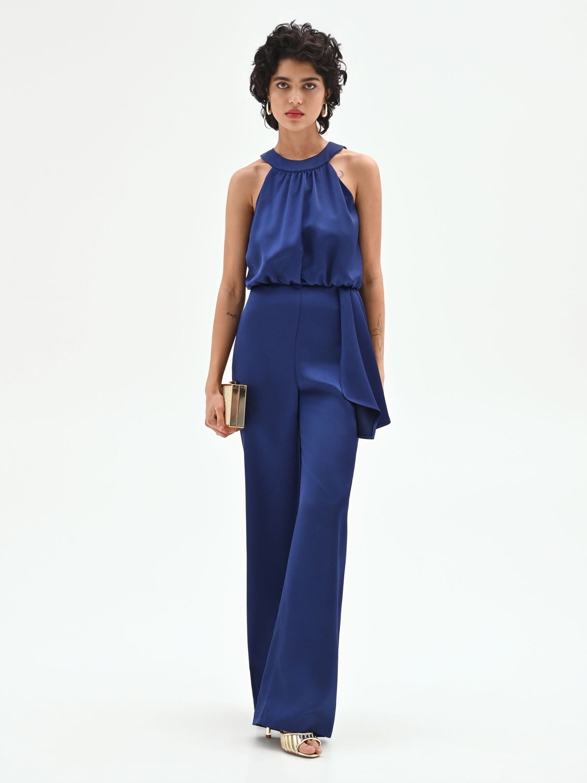 Tuta elegante blu brillante con drappeggio laterale